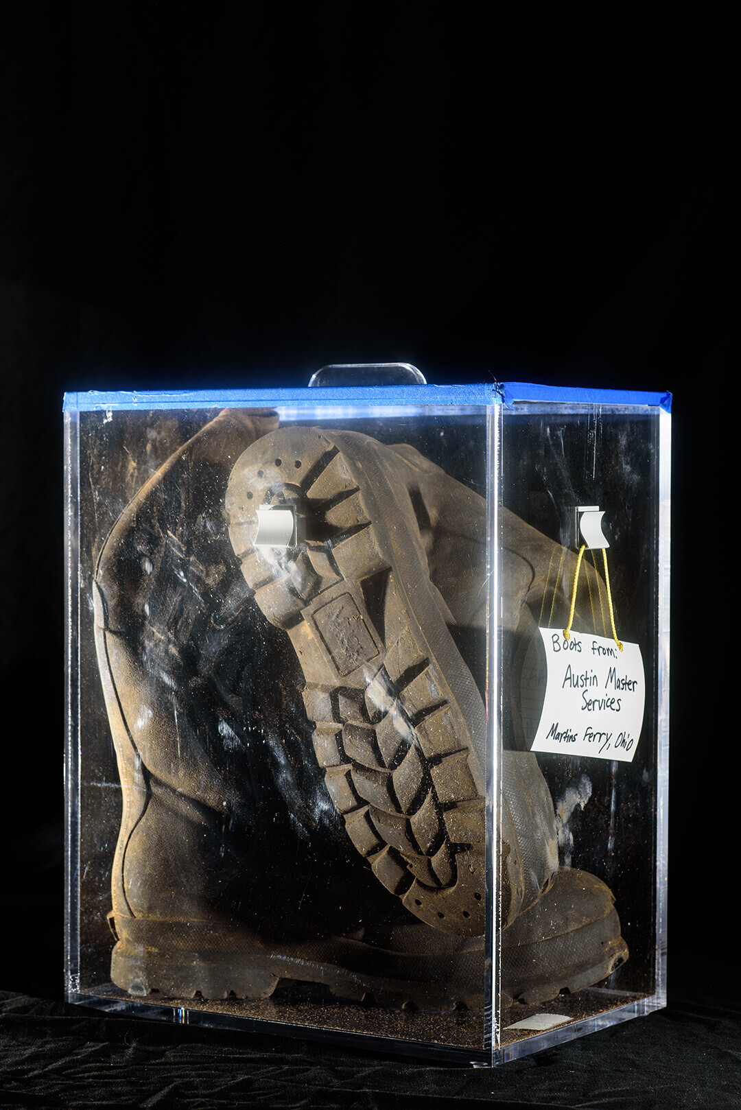 Boots from a former worker at Austin Masters, a fracking waste processing plant, were tested for radioactivity and "revealed radium levels roughly 15 times EPA levels for soil at Superfund sites." In 1980 Congress deemed fracking waste as non-hazardous and therefore exempt from federal rules. (Photograph by Dane DāAquila. Assisted by: Abby Craig and Lyndzey Crupe)