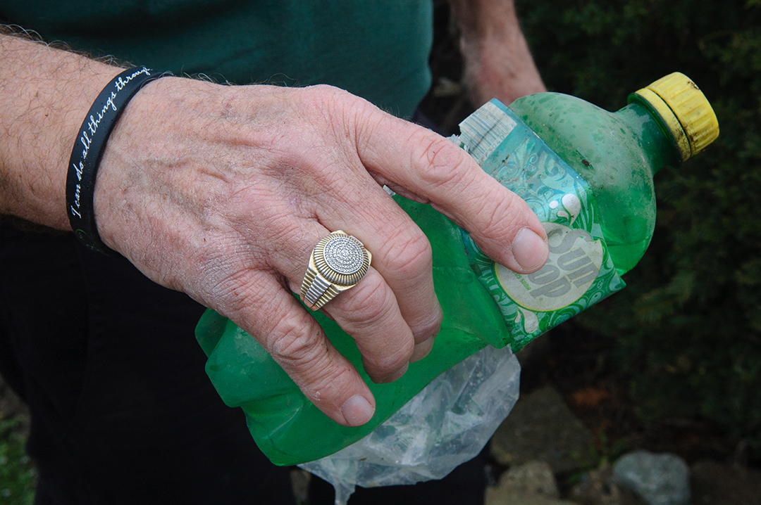Doug Potts, a retired school librarian, spends four hours every day picking up trash in town. (Photograph by Raven Pettigrew)
