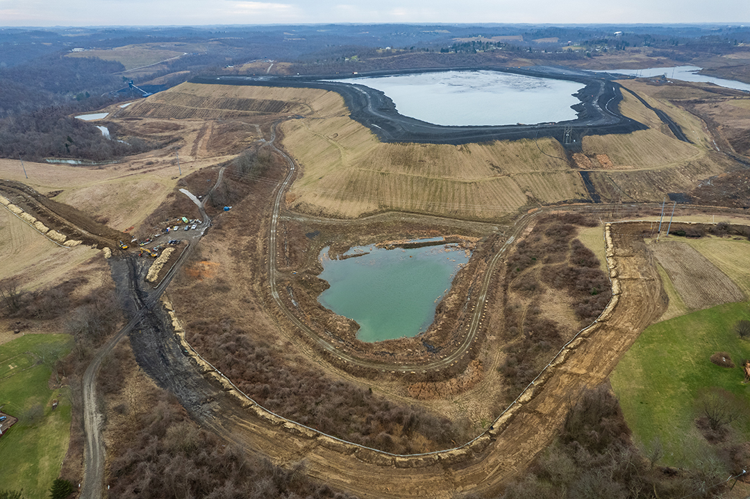 A coal slurry pond in front of Susan's home. Resource extraction has surrounded her. "We're transitioning away from steel and coal, but are heavily invested in petrochemical production in our area. (Photograph by Connor Cruze)